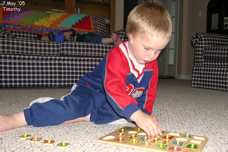 Timothy working on one of his puzzles