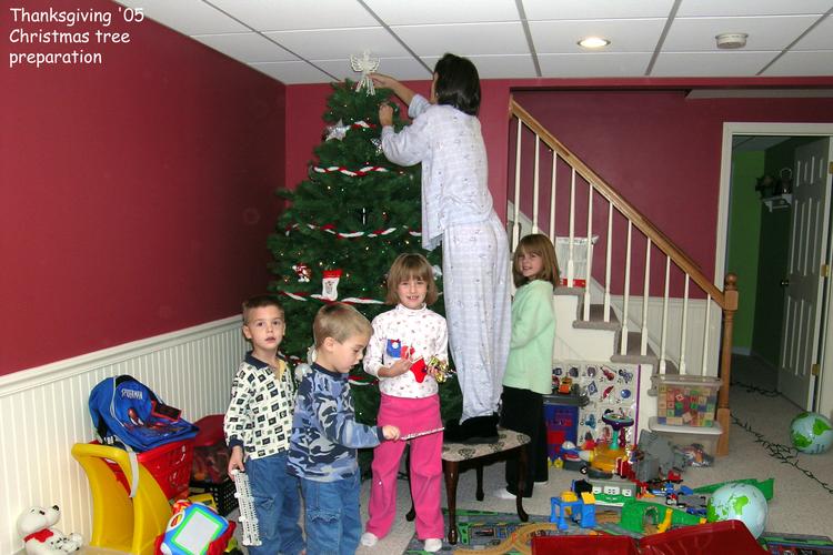 Michelle and the kids trim the tree