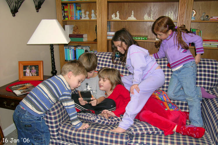 Everyone checking out Nicholas playing Gameboy