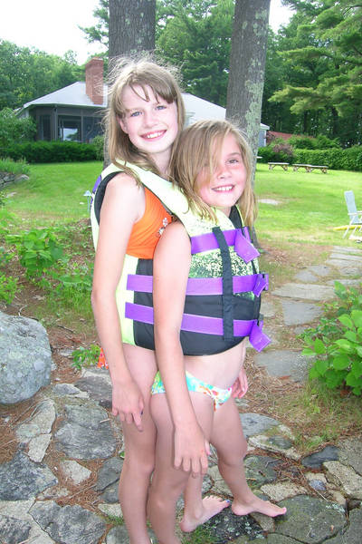 Kelly and Claire squeeze into a life preserver