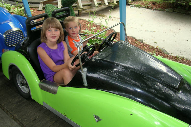 Abigail and Timothy on the Jr. Sport Cars