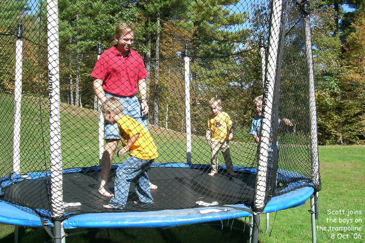 Scott joins the boys on the trampoline