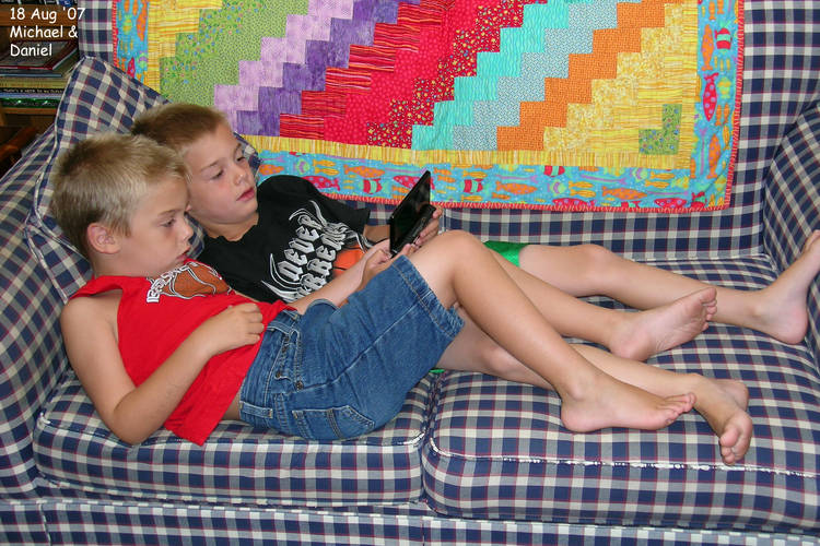 The twins playing a DS game