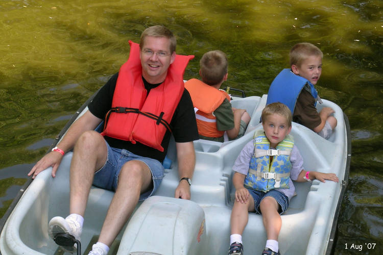 Scott and the boys on a paddle boat