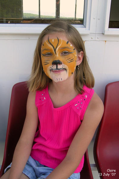 Claire with face painted as a tigress