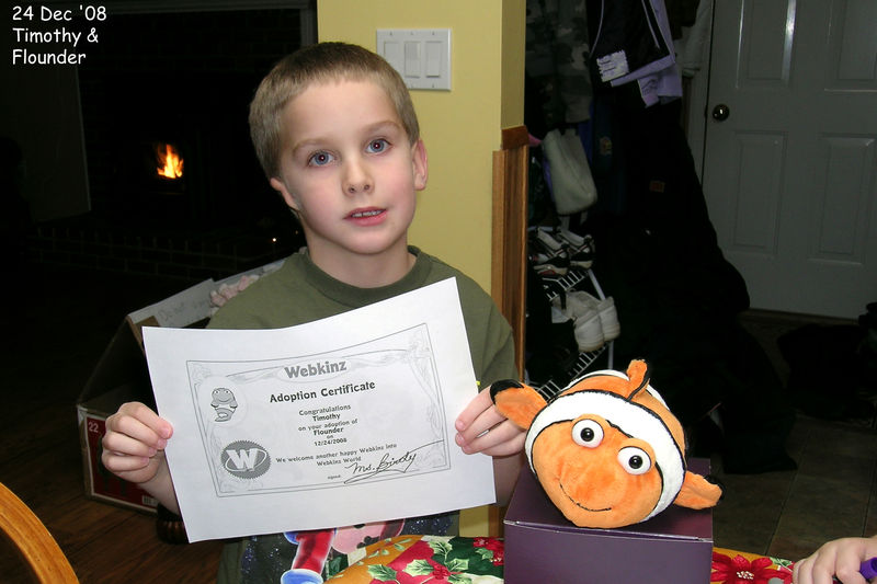 Timothy showing his Christmas Webkinz Flounder
