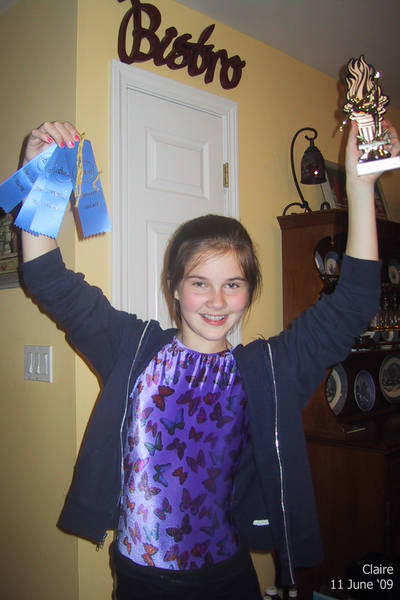 Claire with her gymnastics awards
