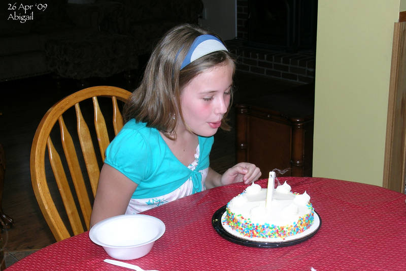 Abigail blowing out her candles