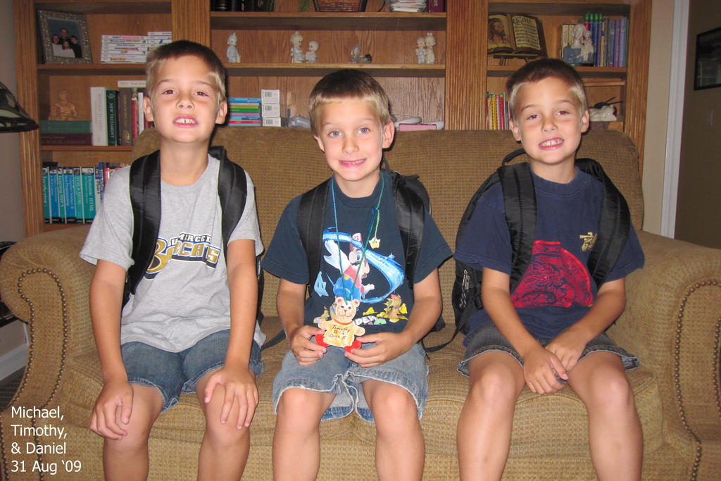 The boys struggling to smile on their first day of school