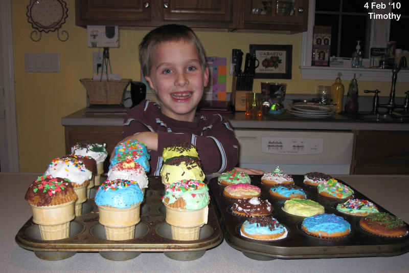 Timothy with his cupcakes
