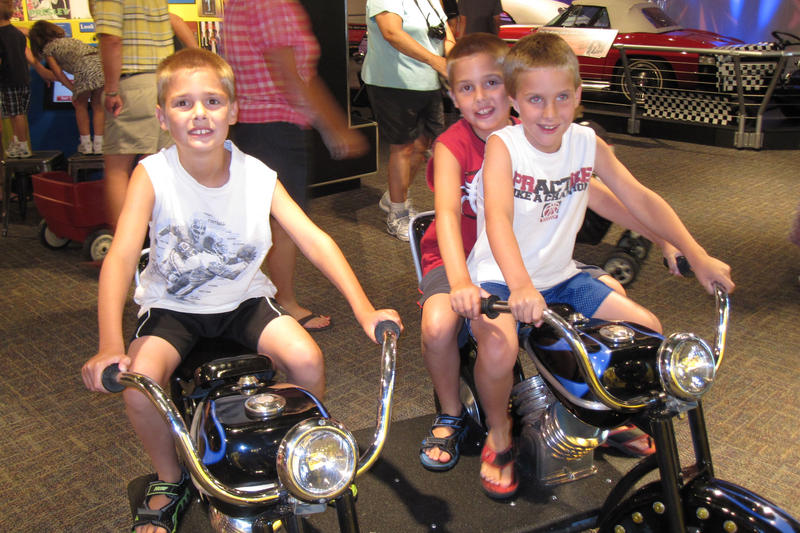 The boys at the motorcycle exhibit