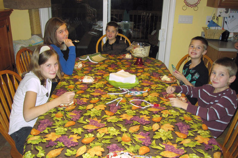 The kids enjoying Thanksgiving dessert