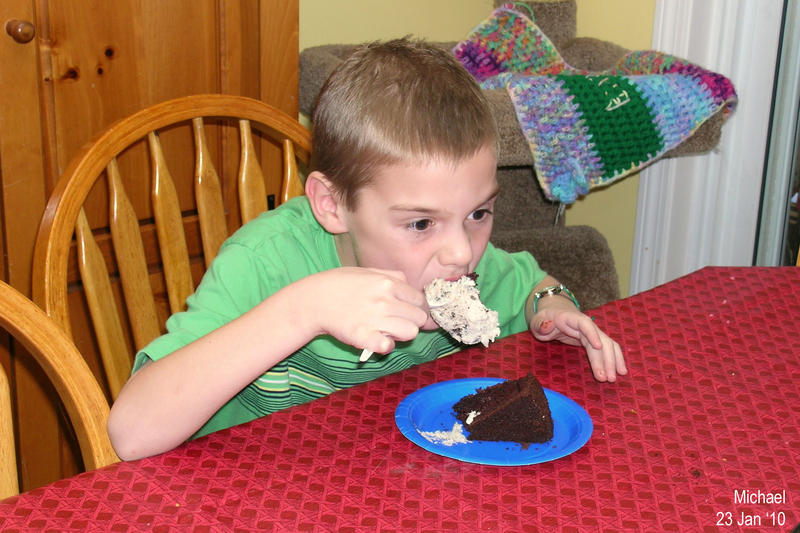 Michael enjoying his cake and ice cream