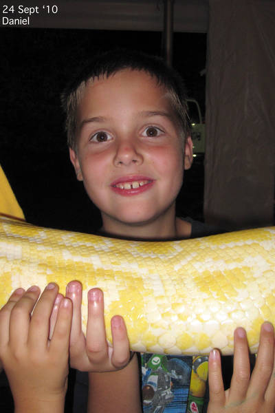 Daniel holding a python