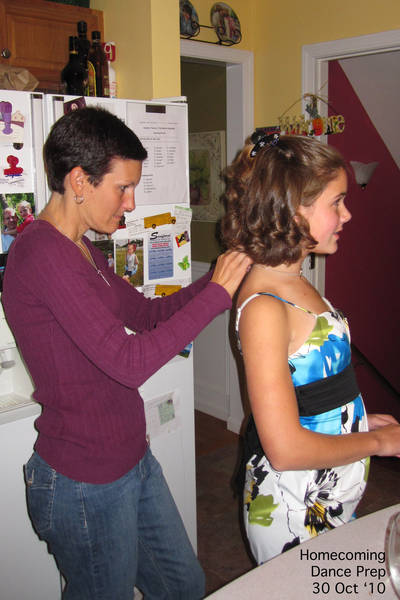 Michelle putting on Claire's necklace before homecoming dance