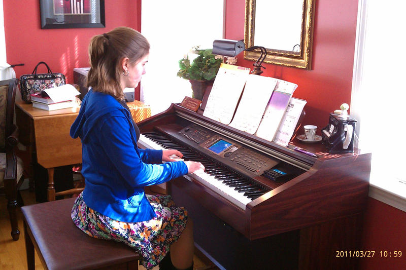 Claire practicing piano