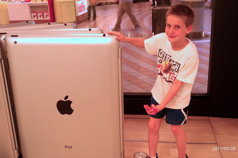 Timothy likes the giant iPad at the Apple Store