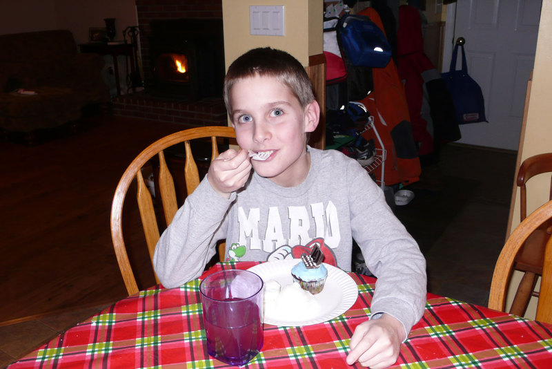 Timothy enjoying his birthday cupcake and ice cream