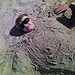Thumbnail of Kyle buried in sand